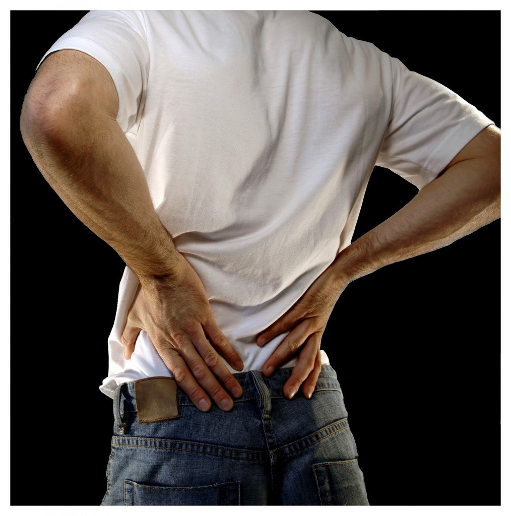 Can back pain cause abdominal pain?