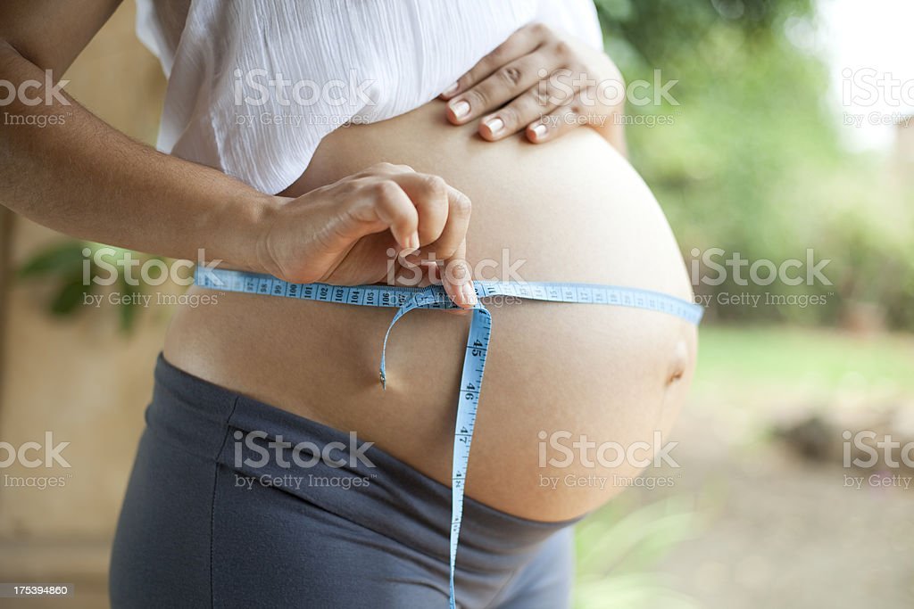 Measuring Pregnant Belly Stock Photo