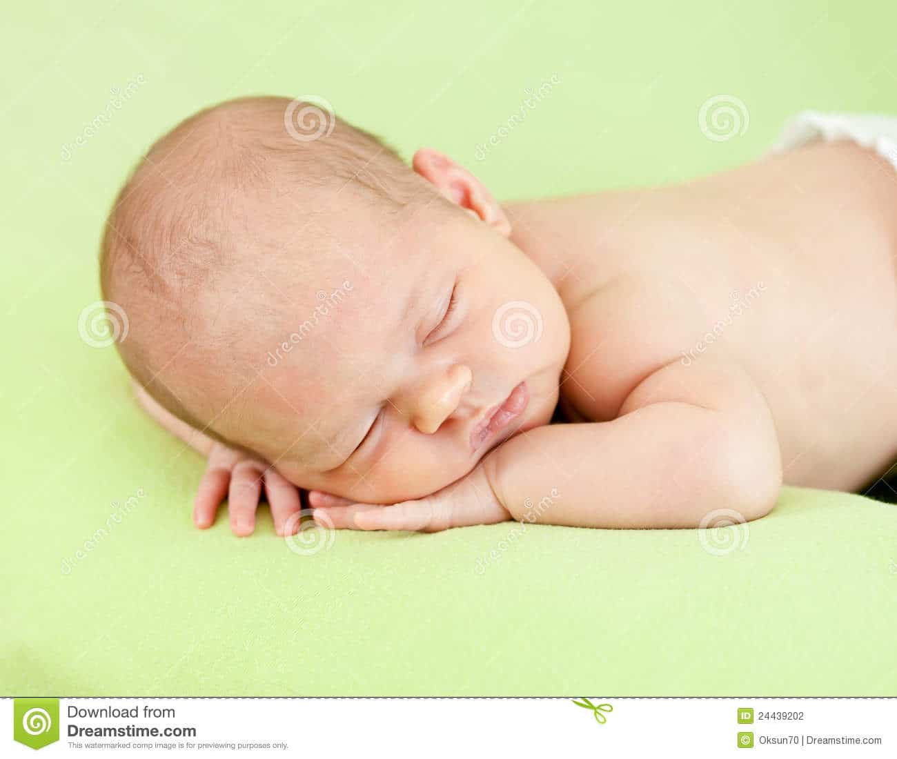 Adorable Baby Sleeping On Stomach Stock Photo